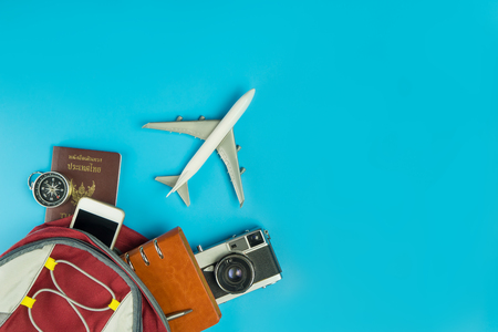 Air plane is flying out of a traveler backpack accessoriesの写真素材