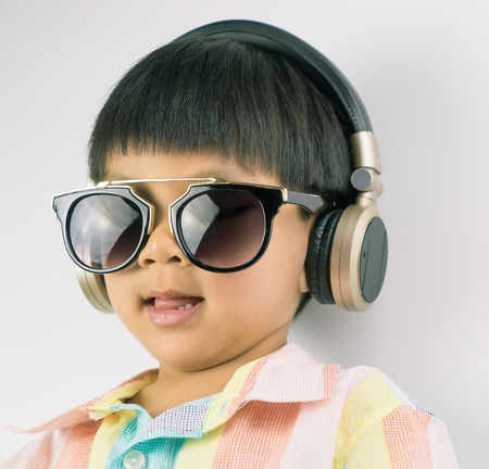 Boy is listening to Music on the headphoneの写真素材