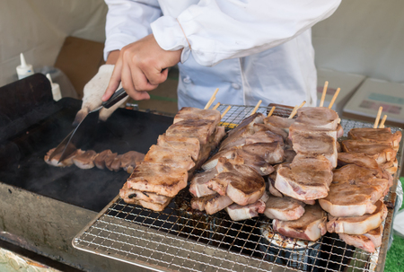 Chef is cooking Japanese grilled beef and pork tongueの写真素材