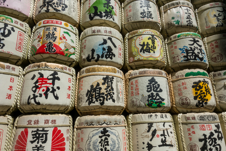 Tokyo, Japan - May 5, 2017: Sake Barrels stock up wall in Meiji Shrine.のeditorial素材