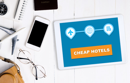 Cheap hotel search online travel agency application on tabletの写真素材