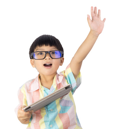 boy holding tablet raise his hand up isolated on whiteの写真素材
