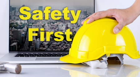 Engineer is picking up safety helmet for Safety First Conceptの写真素材