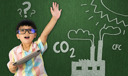 boy holding raise his hand for global warmingの写真素材