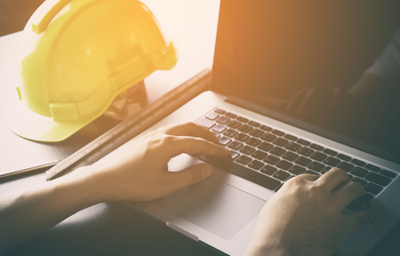Construction Engineer is working with computer in officeの写真素材