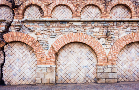 Ruined Broken Medival brick wall for texture backgroundの写真素材