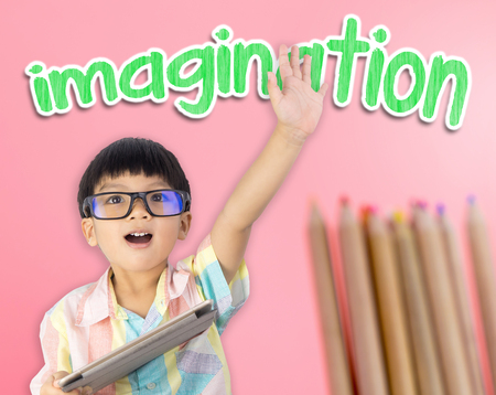 Boy raised his hand showing that Imagination is importantの写真素材