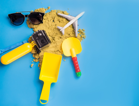 Summer travel toys and accessories on blue backgroundの写真素材