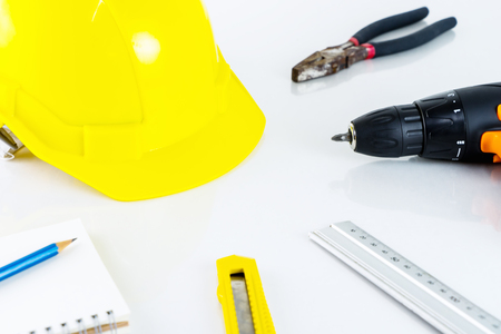 Repair man construction worker tools on white deskの写真素材