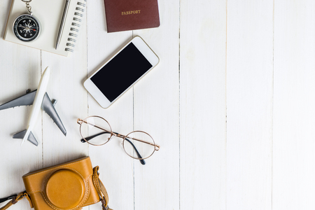 Travel Blogger accessories on white wood copy spaceの写真素材