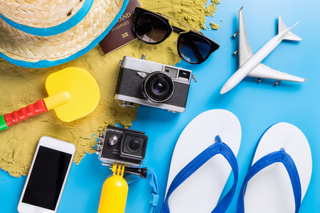 Summer Beach Vacation travel accessories and fashion on blueの写真素材