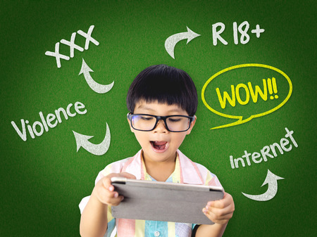 Kid is surprising on Dangerous contents on Internetの写真素材