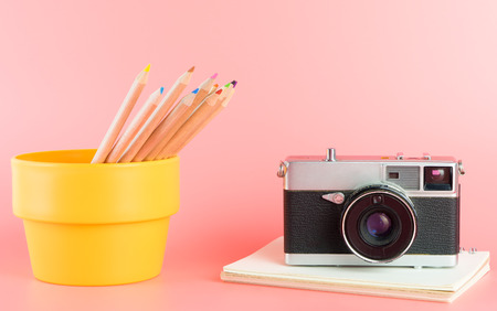 Color pencils with photo camera for Art concept on pinkの写真素材