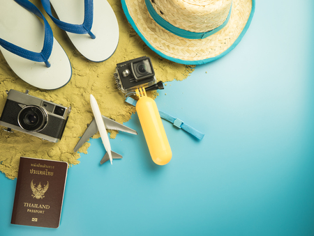 Summer travel Vacation fashion and gadgets on sand blue copy spaceの写真素材