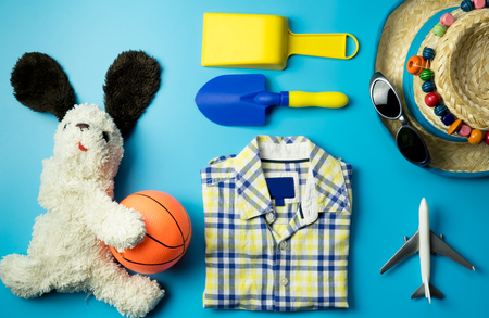 Kid Boy summer fashion and accessories on blue backgroundの写真素材
