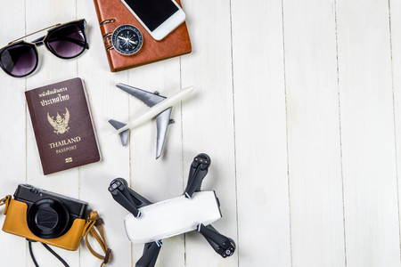 Summer Beach travel toy and gadgets on white wooden copy spaceの写真素材