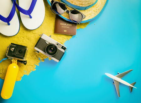 Summer Beach island travel fashion gadgets and toys on blue copy spaceの写真素材