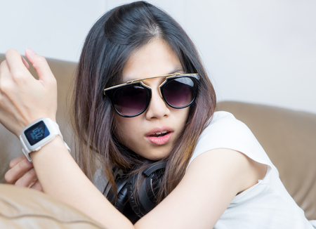 Modern Fashion Asian girl with sunglasses and smartwatchの写真素材