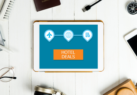Hotel deal application website on tablet screen for travel agencyの写真素材