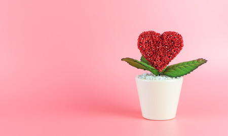Heart love flower pot on pink copy spaceの写真素材