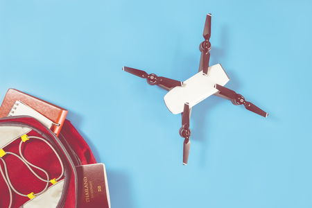 packing drone for vacation travel on blue backgroundの写真素材