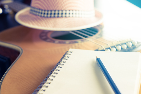 Blank notebook on guitar for songwriterの写真素材