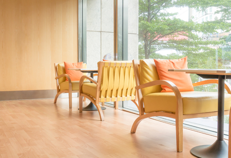 Orange tone bright cafe restaurant seating area.の写真素材
