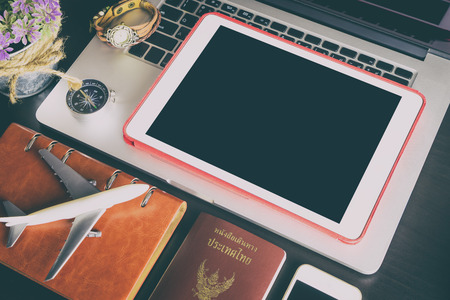 Blank Tablet screen with travel objects for business travelerの写真素材
