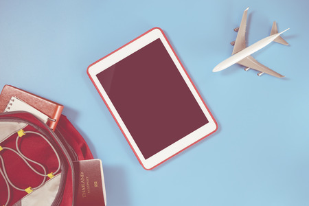 Empty tablet screen with backpacker travel objectsの写真素材