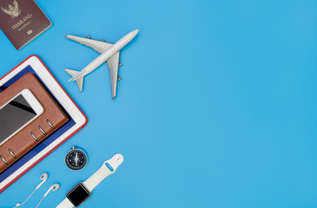 Travel accessories and objects for business traveler on blue copy spaceの写真素材