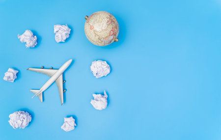 Toy plane in paper cloud flying to the Earthの写真素材