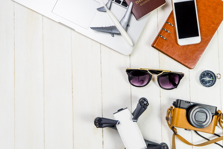 Hi Tech Travel objects and gadgets for modern traveler with white wooden copy spaceの写真素材