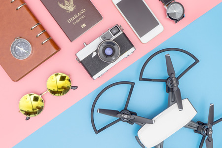 Travel Gadget Drone and other objects on blue and pink backgroundの写真素材