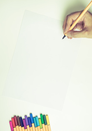 Hand writing on blank pepar with color pensの写真素材