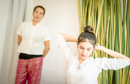 Beautiful lady with Masseur prepare for massageの写真素材