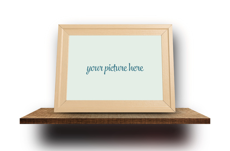 Blank photo frame mock up on wooden shelf display isolated on whiteの写真素材