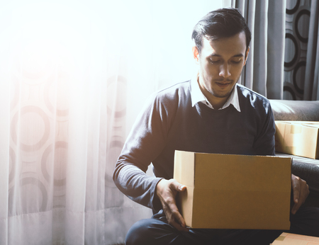 Man is preparing package order for his online retail customerの写真素材