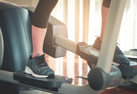 Foot working out on stepper exercise machineの写真素材