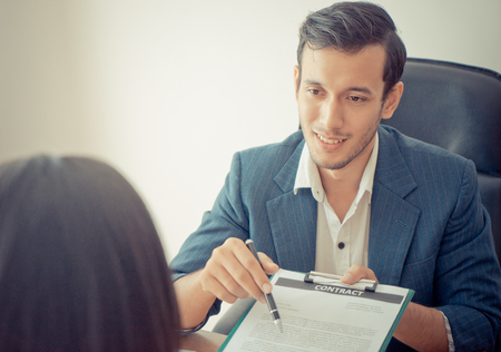 New Employer have been invited to sign work contract after successful job interviewの写真素材