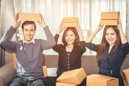 Team of start up online business owner celebrating sale order
