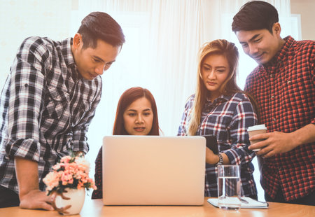Asian business team is meeting on laptop computerの写真素材