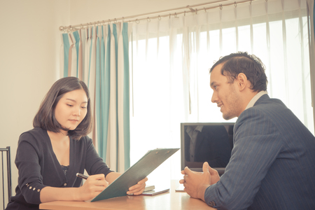 Executive is taking note in business job interviewの写真素材