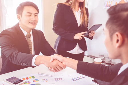 Happy business man with confidence hand shake with partnerの写真素材