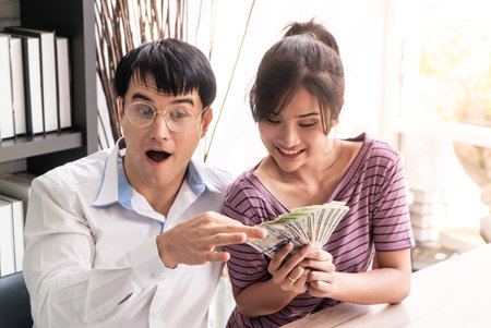 Married Couple counting money getting rich in family business