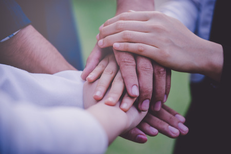 Four hand together in business meeting for team conceptの写真素材
