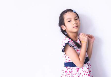 Little Asian girl portrait in sweet vintage dressの写真素材