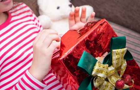 Girl in red is open Christmas surprise box presentの写真素材