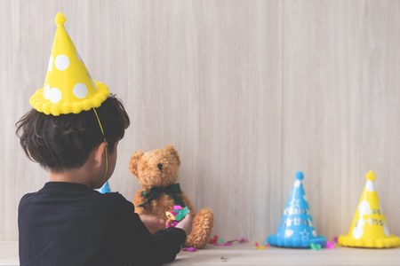 Little boy is setting up his birthday partyの写真素材