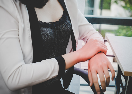 Female worker having office syndrome injury on her wrist carpal tunnelの写真素材