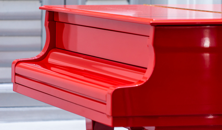 Side view of a Red Grand piano closed coverの写真素材